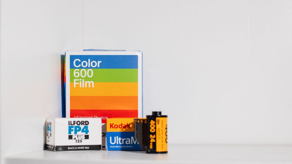 A flat-lay photograph displays a pricing form for waste disposal services on a clipboard, featuring sections titled 'Materials,' 'Labour,' 'Experience,' and 'Pro...' in black and pink text, with the h